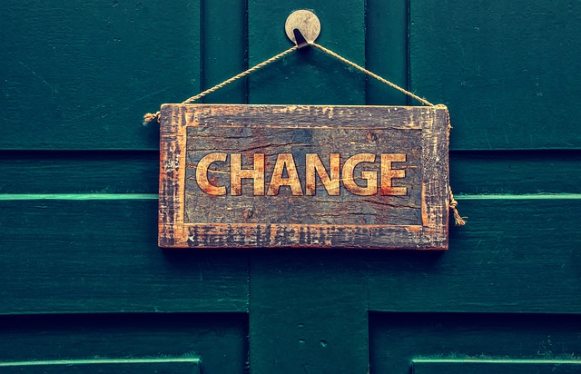 change sign hanging on wooden door